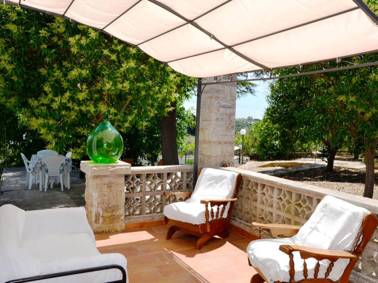 Sofas and armchairs on the veranda of the holiday house